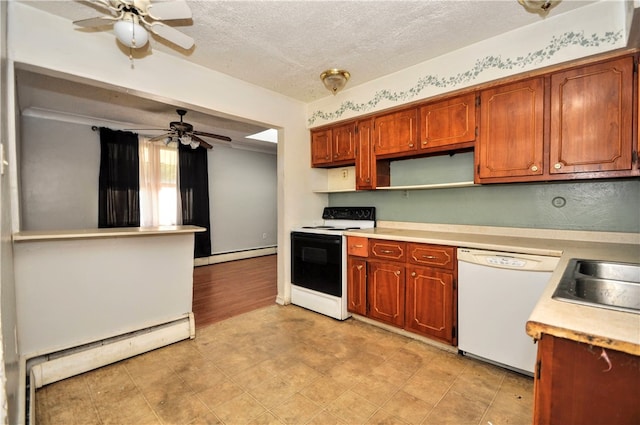 kitchen featuring white appliances, baseboard heating, ceiling fan, and a textured ceiling