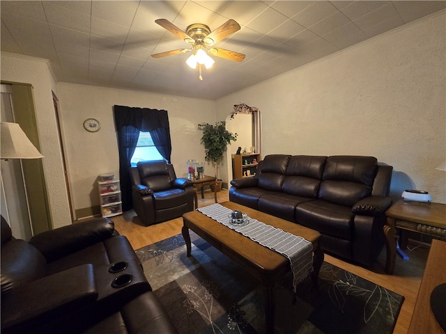 living room with hardwood / wood-style floors and ceiling fan