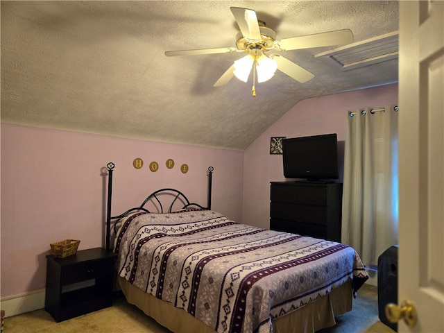 bedroom with a textured ceiling, ceiling fan, and vaulted ceiling