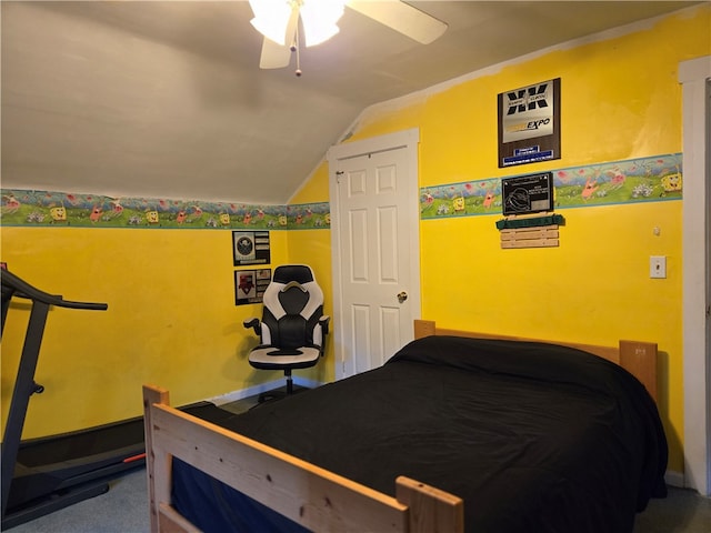 bedroom featuring lofted ceiling, a closet, ceiling fan, and carpet