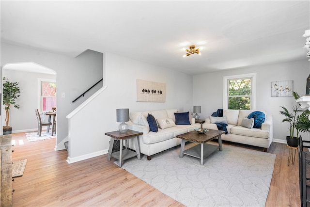 living room with light hardwood / wood-style flooring