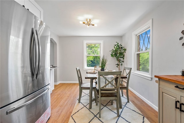 dining area with light hardwood / wood-style floors