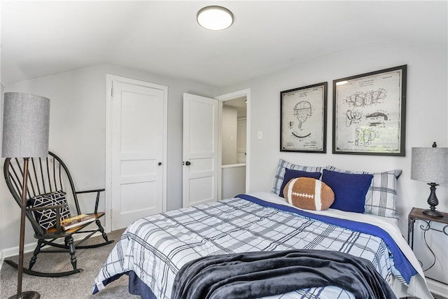 carpeted bedroom featuring lofted ceiling