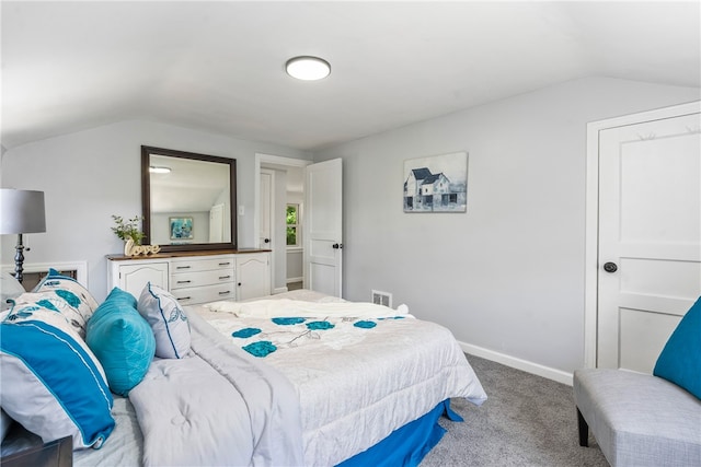 carpeted bedroom featuring vaulted ceiling