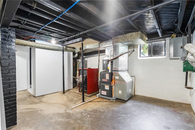 basement featuring electric panel and heating unit