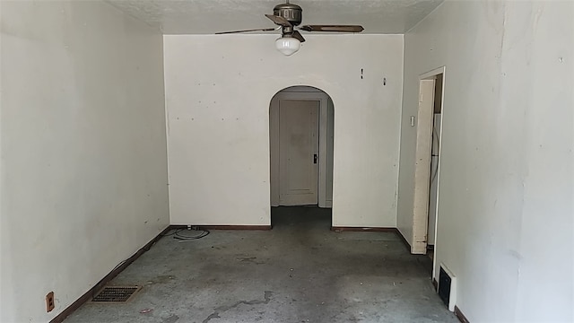 unfurnished room with concrete flooring and ceiling fan