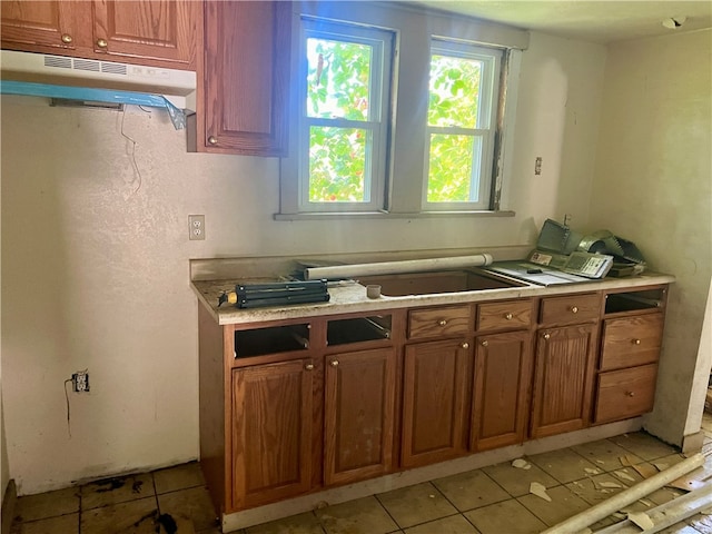 kitchen with light tile patterned flooring