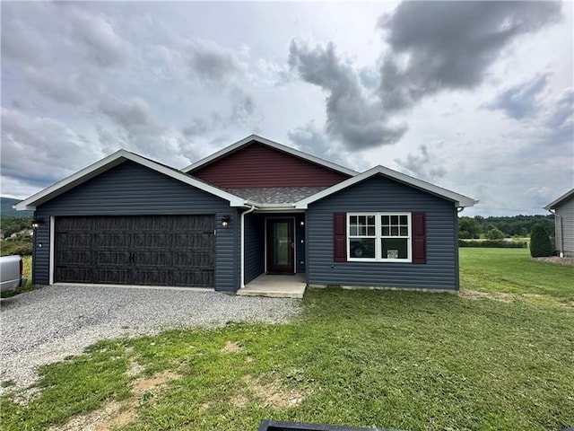 single story home with a garage and a front yard