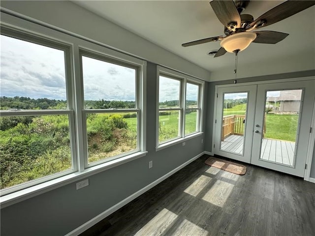 unfurnished sunroom with french doors, plenty of natural light, and ceiling fan