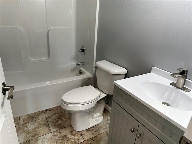 full bathroom with  shower combination, vanity, and toilet