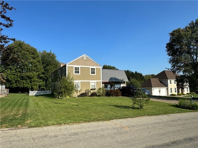 view of side of property featuring a lawn