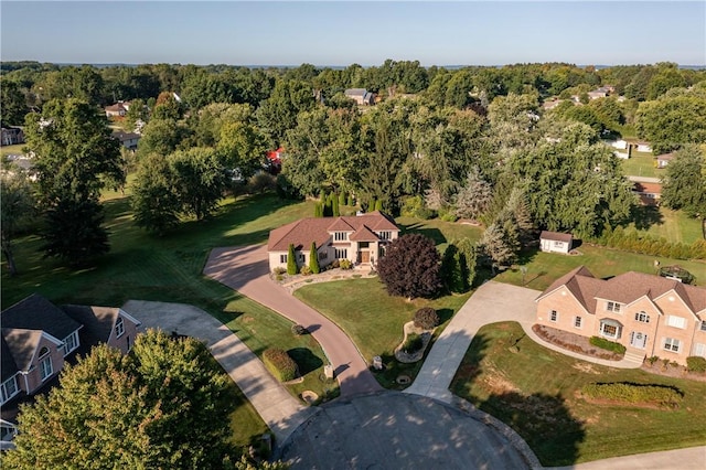 drone / aerial view featuring a forest view