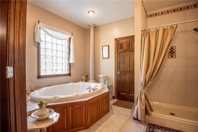 full bath featuring a bath, a shower stall, and tile patterned flooring