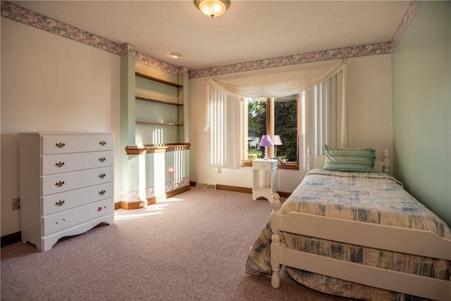 bedroom featuring visible vents, carpet floors, and baseboards