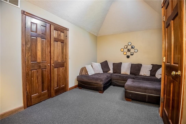 living room with visible vents, baseboards, lofted ceiling, carpet floors, and a textured ceiling