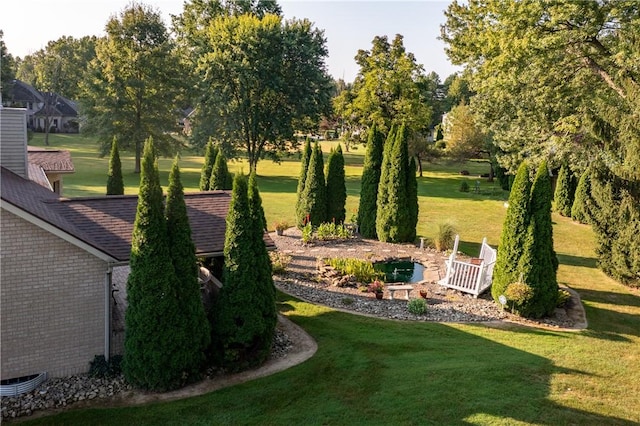 view of home's community featuring a lawn