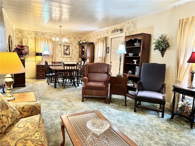 carpeted living room with a chandelier