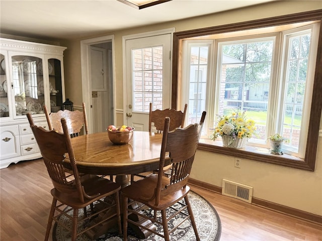 dining space featuring light hardwood / wood-style floors