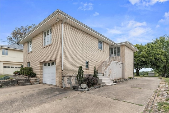 view of side of property with a garage