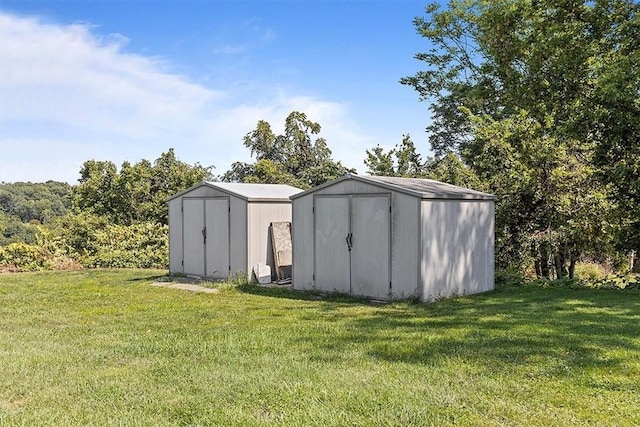 view of outdoor structure featuring a lawn