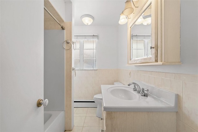 full bathroom featuring a baseboard radiator, tile patterned flooring, toilet, shower / tub combination, and vanity