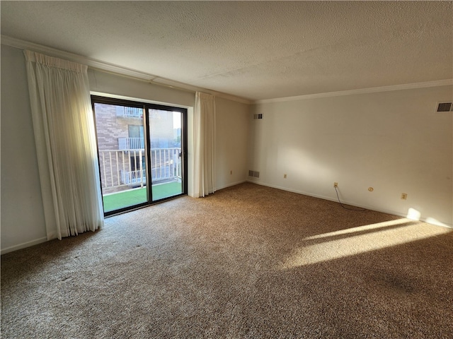 empty room featuring ornamental molding, a textured ceiling, and carpet floors