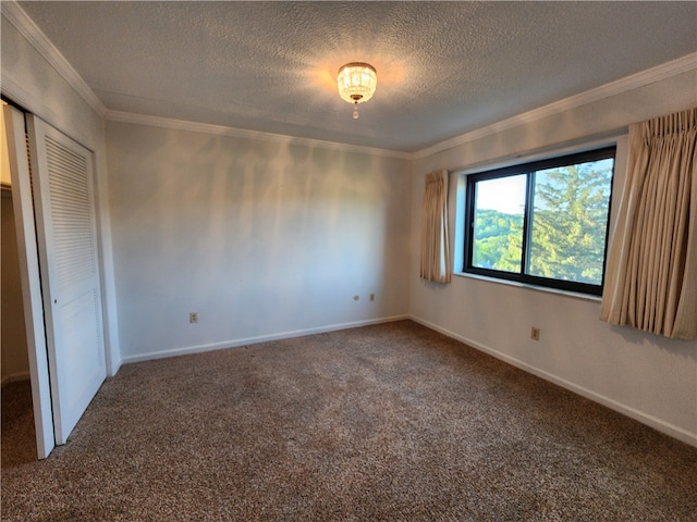 unfurnished bedroom featuring a closet, ornamental molding, a textured ceiling, and carpet