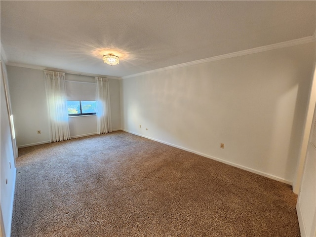 carpeted spare room featuring ornamental molding and a textured ceiling