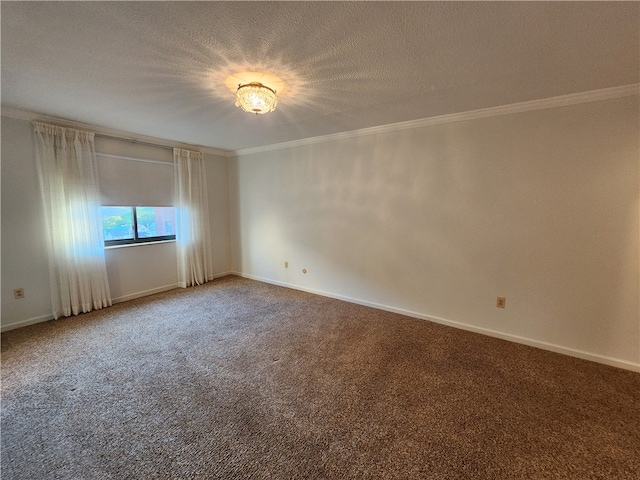 carpeted empty room featuring ornamental molding and a textured ceiling