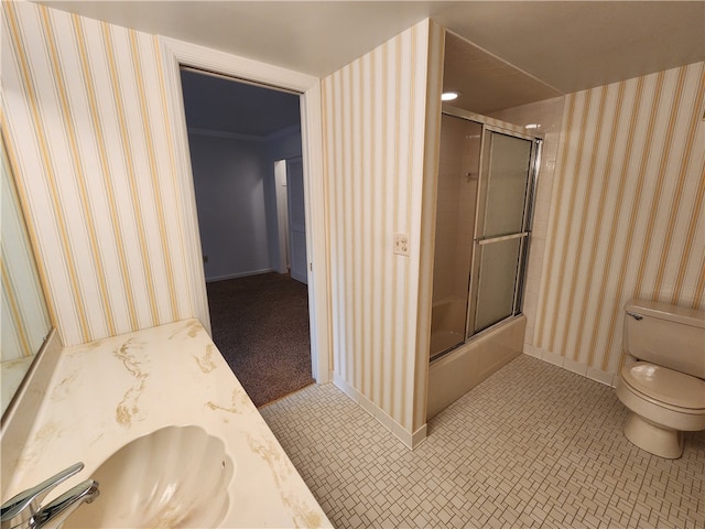 full bathroom with toilet, tile patterned flooring, crown molding, bath / shower combo with glass door, and vanity