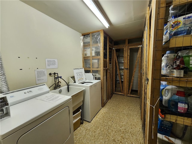 laundry area with washing machine and clothes dryer