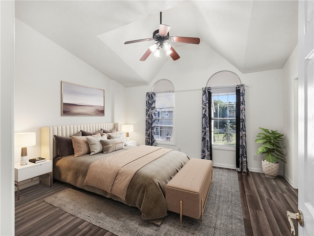 bedroom with ceiling fan, lofted ceiling, and dark hardwood / wood-style floors