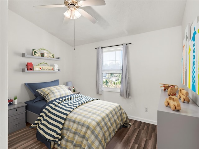 bedroom with dark wood-type flooring and ceiling fan