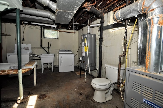 basement with washer / dryer, heating unit, sink, and gas water heater