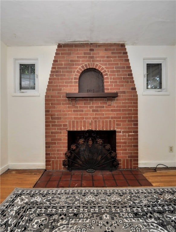 details with a fireplace and hardwood / wood-style floors