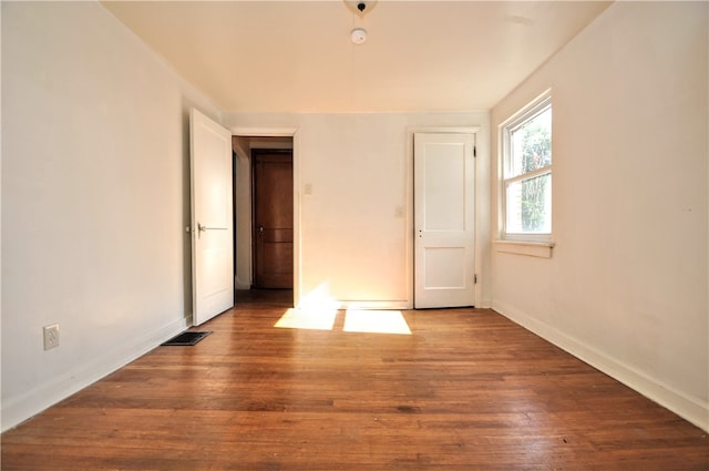 unfurnished room featuring hardwood / wood-style floors