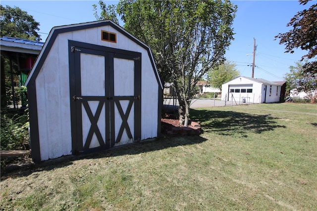 view of outdoor structure with a lawn