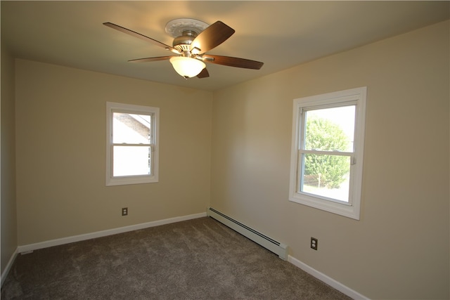 carpeted spare room with ceiling fan and baseboard heating