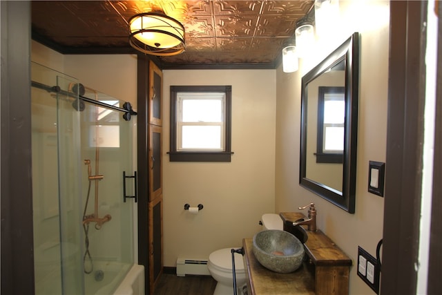 bathroom with vanity, wood-type flooring, a baseboard radiator, toilet, and a shower with door