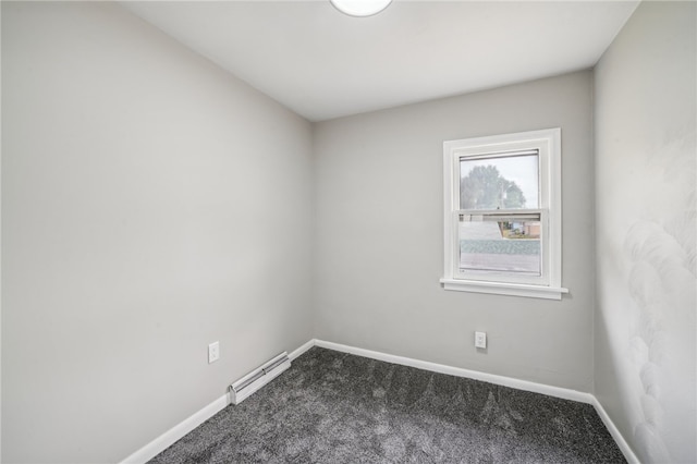 unfurnished room featuring a baseboard radiator and carpet