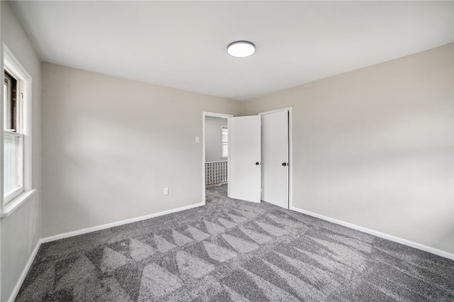 unfurnished bedroom featuring carpet flooring