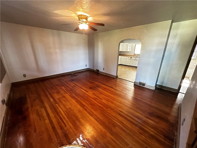 unfurnished room featuring ceiling fan and wood-type flooring