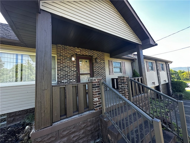 doorway to property with covered porch