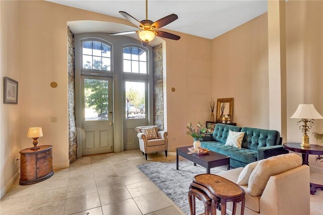 interior space with ceiling fan