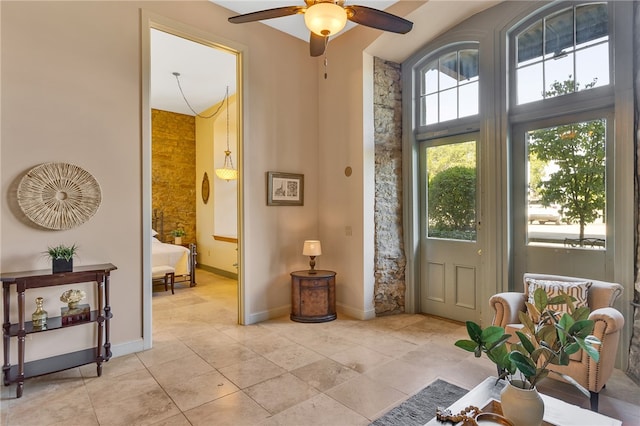 doorway to outside with ceiling fan