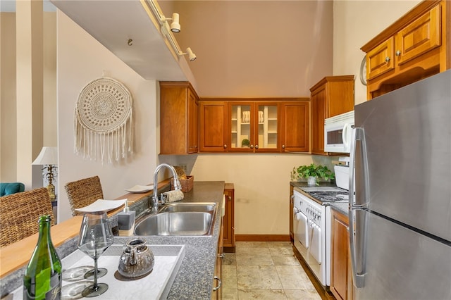 kitchen featuring sink and white appliances