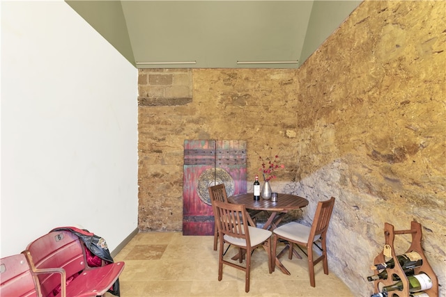 dining space with lofted ceiling