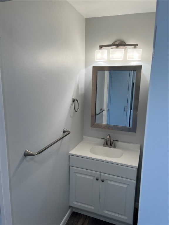 bathroom featuring vanity and hardwood / wood-style flooring