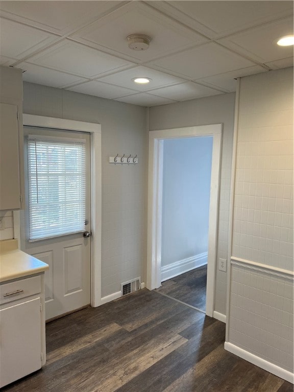 unfurnished dining area with dark hardwood / wood-style flooring