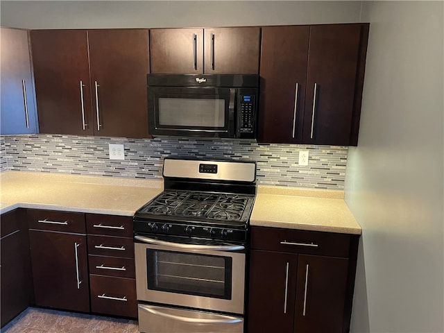 kitchen with gas range, dark brown cabinets, and tasteful backsplash